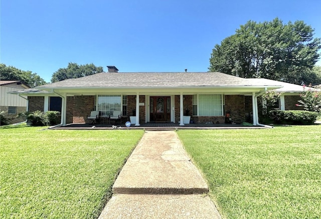 1601 Yarborough Dr, Sherman, TX 75092 - single story home featuring a front lawn, a porch, a chimney, and brick siding