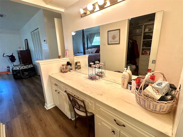 bathroom with hardwood / wood-style floors and vanity