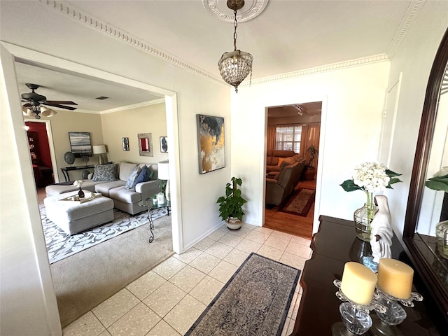 interior space featuring a notable chandelier, light tile patterned flooring, and ornamental molding