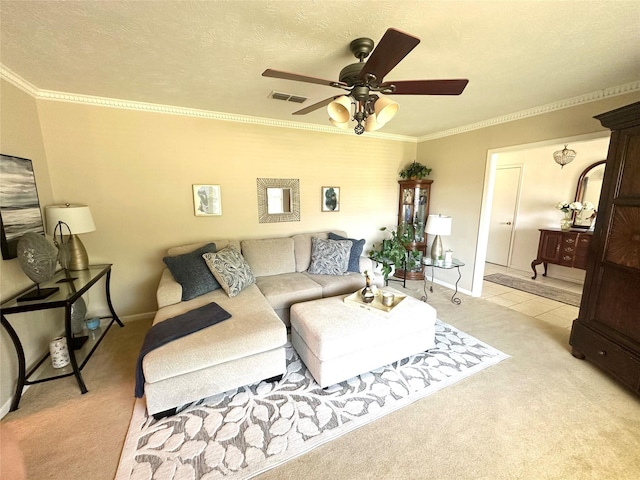 living room featuring crown molding, ceiling fan, light colored carpet, baseboards, and visible vents