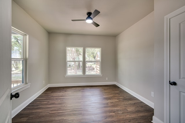 unfurnished room with ceiling fan and dark hardwood / wood-style floors