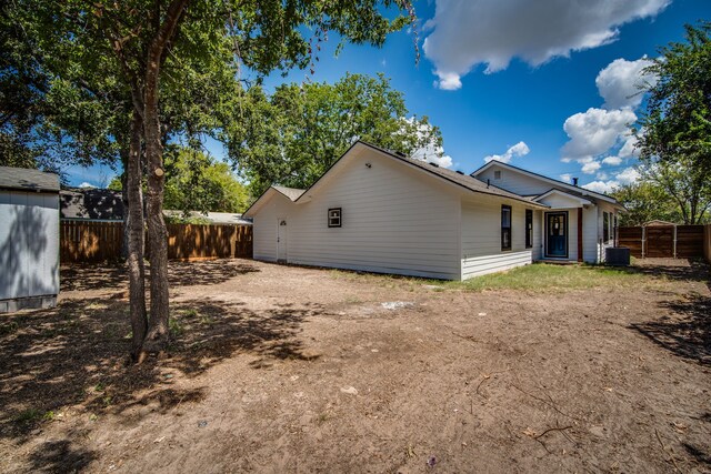 back of property with central AC