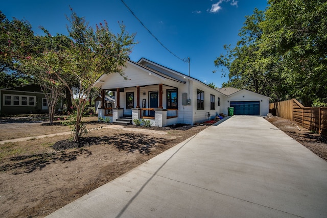 view of front of home with a porch and a garage