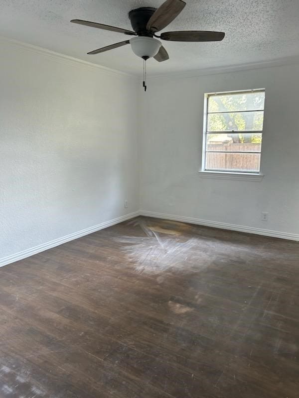 empty room featuring a textured ceiling, ceiling fan, ornamental molding, and wood-type flooring