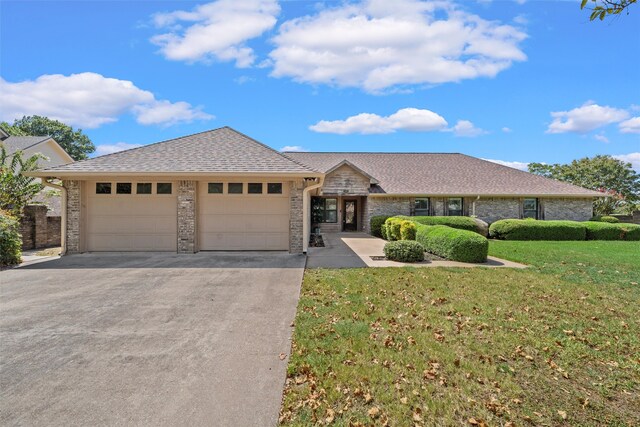 view of front facade with a garage and a front yard