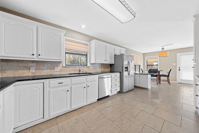 kitchen featuring white cabinetry, appliances with stainless steel finishes, and sink