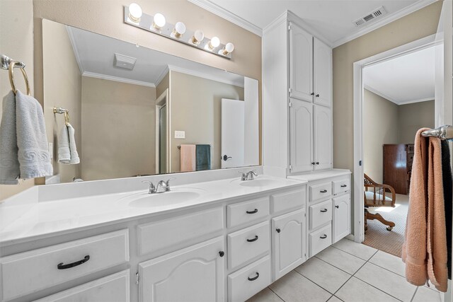 bathroom with tile patterned flooring, double sink vanity, and crown molding