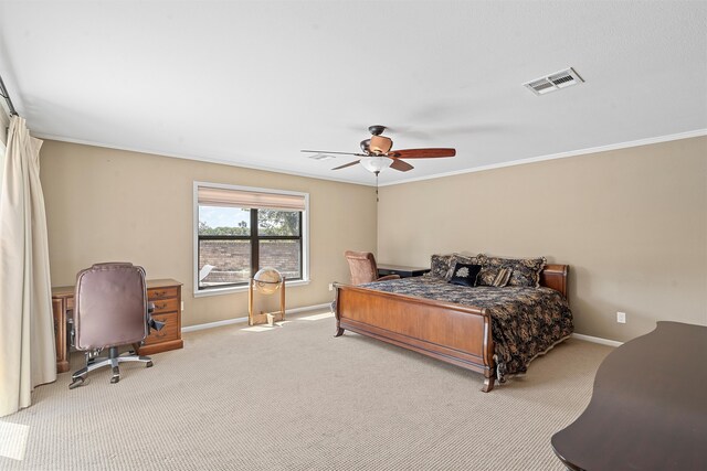 carpeted bedroom with ceiling fan and crown molding