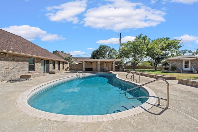 view of swimming pool featuring a patio