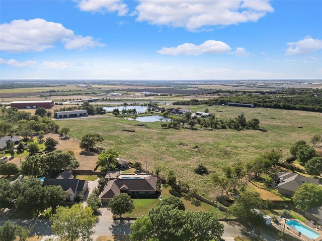 bird's eye view featuring a rural view and a water view