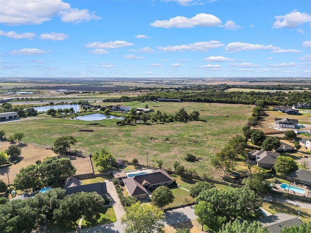 drone / aerial view with a rural view and a water view