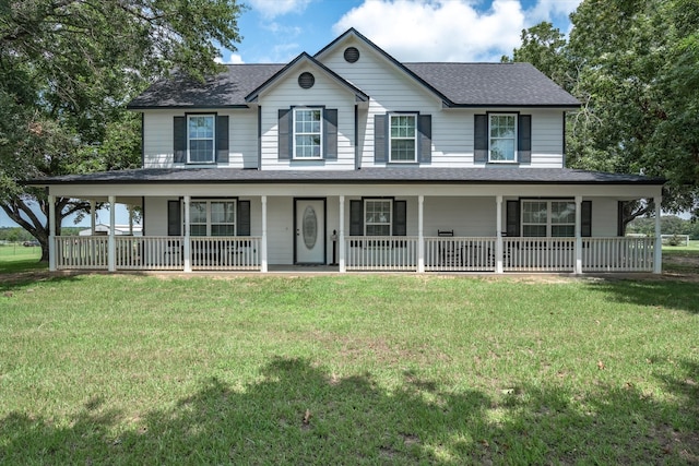 farmhouse inspired home featuring a porch and a front yard