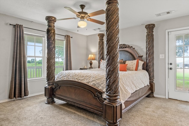 carpeted bedroom with multiple windows and ceiling fan