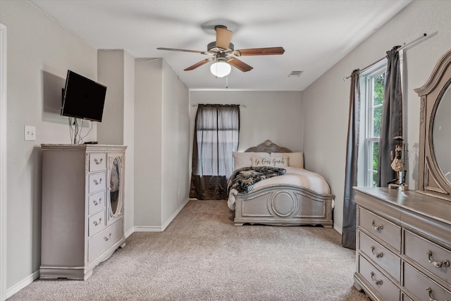 bedroom featuring ceiling fan and light colored carpet