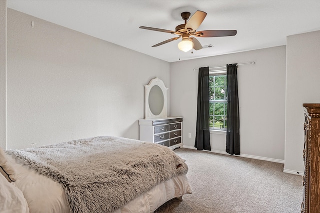 bedroom with ceiling fan and light carpet