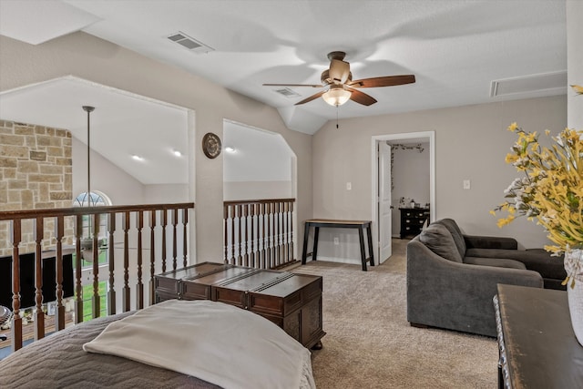 interior space featuring light colored carpet, lofted ceiling, and ceiling fan