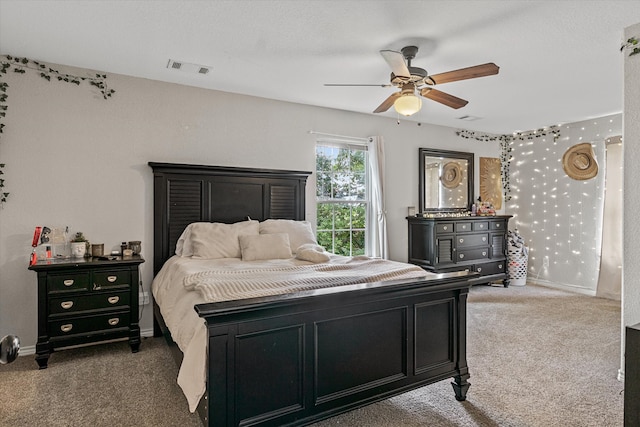 carpeted bedroom with ceiling fan