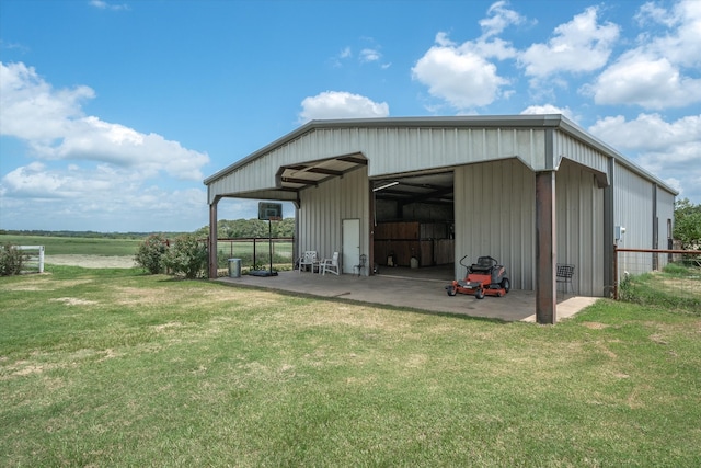 view of outbuilding with a yard