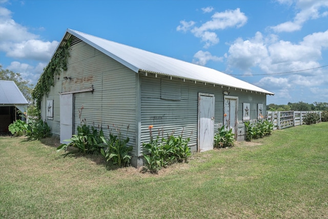 view of side of property with a yard