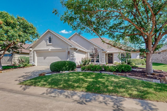 single story home with a garage and a front lawn