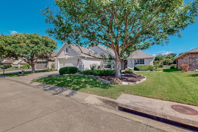 view of front facade with a garage and a front yard