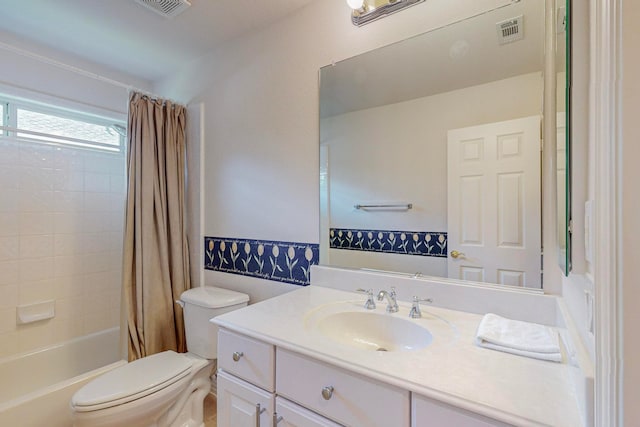 full bathroom with shower / tub combo, vanity, and toilet