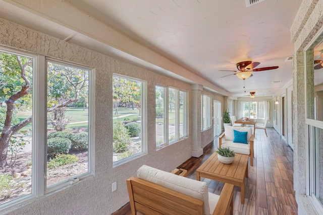 sunroom with ceiling fan