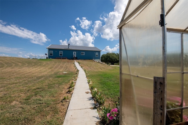 1204 County Road 122, Hico, TX 76457 - view of yard featuring a greenhouse and an outdoor structure