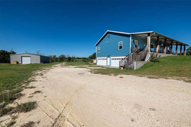 1204 County Road 122, Hico, TX 76457 - exterior space featuring a lawn, a porch, and dirt driveway