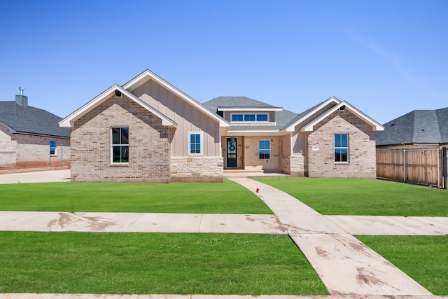 craftsman-style house with a front yard