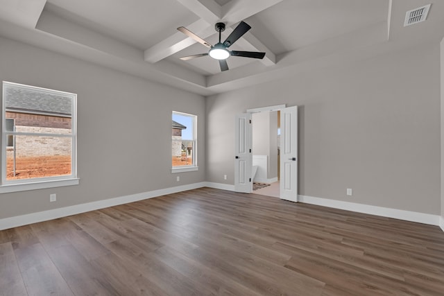 unfurnished room featuring beamed ceiling, wood-type flooring, and ceiling fan