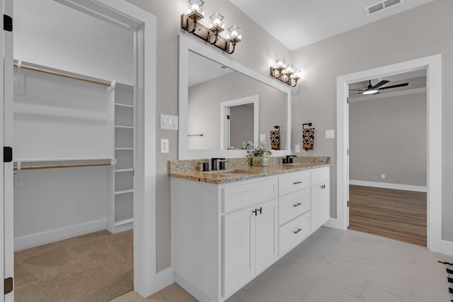 bathroom featuring vanity, ceiling fan, and hardwood / wood-style flooring