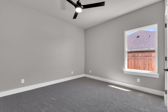 carpeted empty room featuring ceiling fan