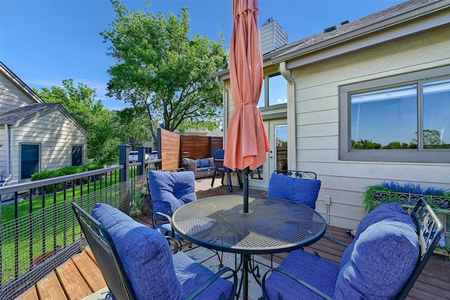 wooden deck with an outdoor living space