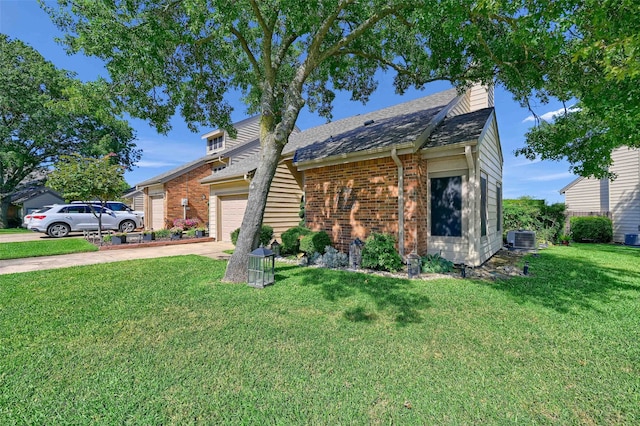 view of front of home featuring an attached garage, brick siding, a front lawn, driveway, and cooling unit