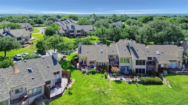 birds eye view of property with a residential view
