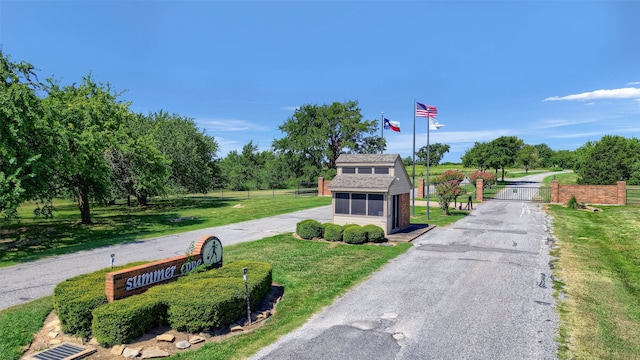 view of property's community with a lawn