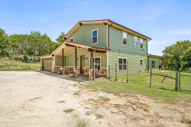 view of front facade with a garage and a front lawn