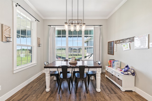 dining space with ornamental molding, dark wood-type flooring, and a notable chandelier