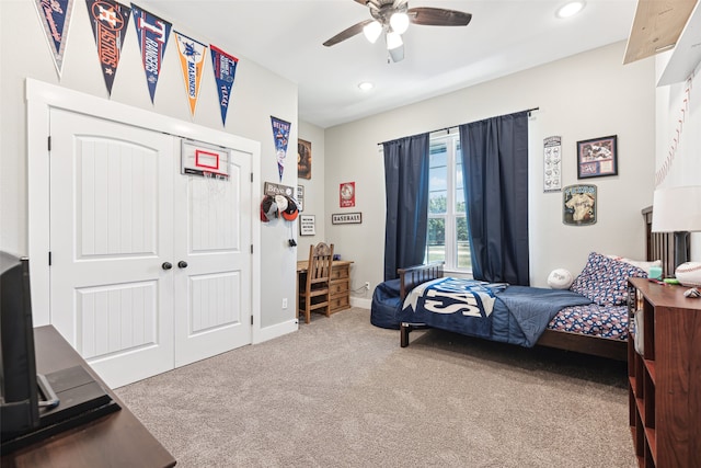 bedroom with a closet, ceiling fan, and carpet floors