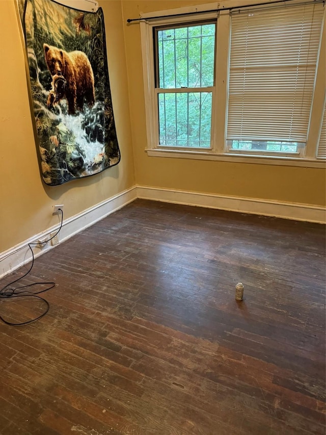 3114 W College St, Shreveport, LA 71109 - empty room with baseboards and dark wood finished floors