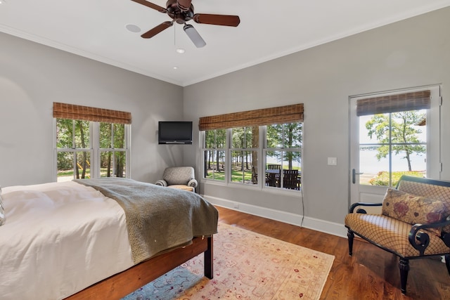 bedroom featuring ceiling fan, crown molding, and wood-type flooring