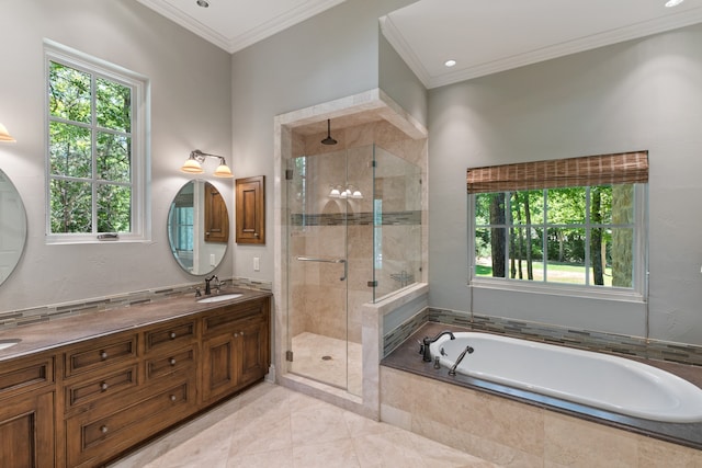 bathroom featuring shower with separate bathtub, tile patterned flooring, plenty of natural light, and vanity