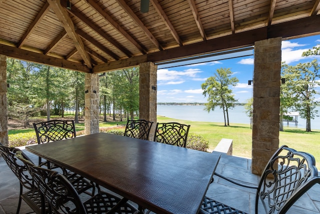 view of patio / terrace with a gazebo and a water view