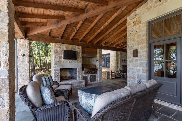 view of patio with an outdoor living space, ceiling fan, and area for grilling