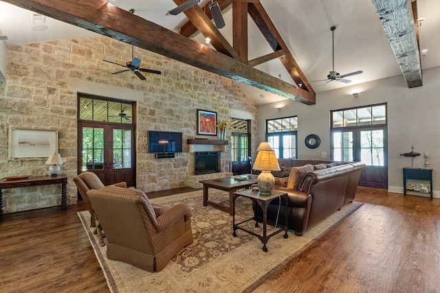 living room featuring dark hardwood / wood-style flooring, plenty of natural light, and french doors