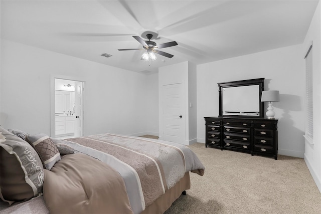 carpeted bedroom featuring ensuite bathroom and ceiling fan