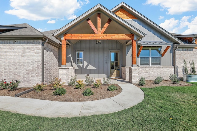 exterior space featuring a porch and a lawn