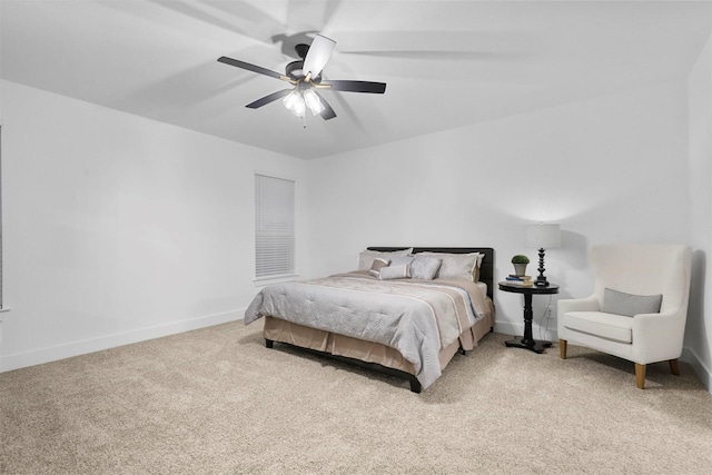 bedroom featuring ceiling fan and light carpet