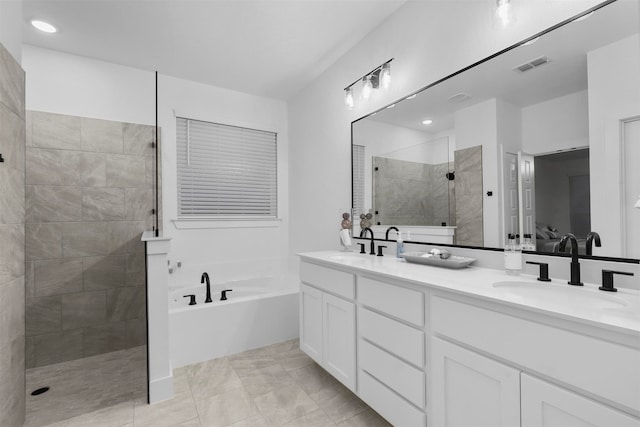 bathroom featuring vanity, tile patterned floors, and independent shower and bath